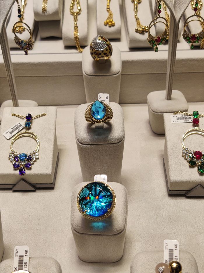 pexels photo 14587263 Showcasing a collection of exquisite luxury rings with gemstones in a display case.